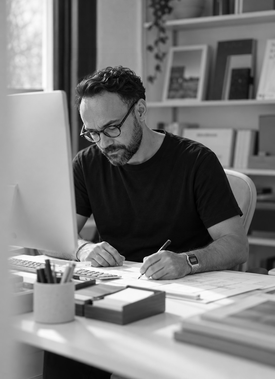 César Gutierrez sketching at his desk