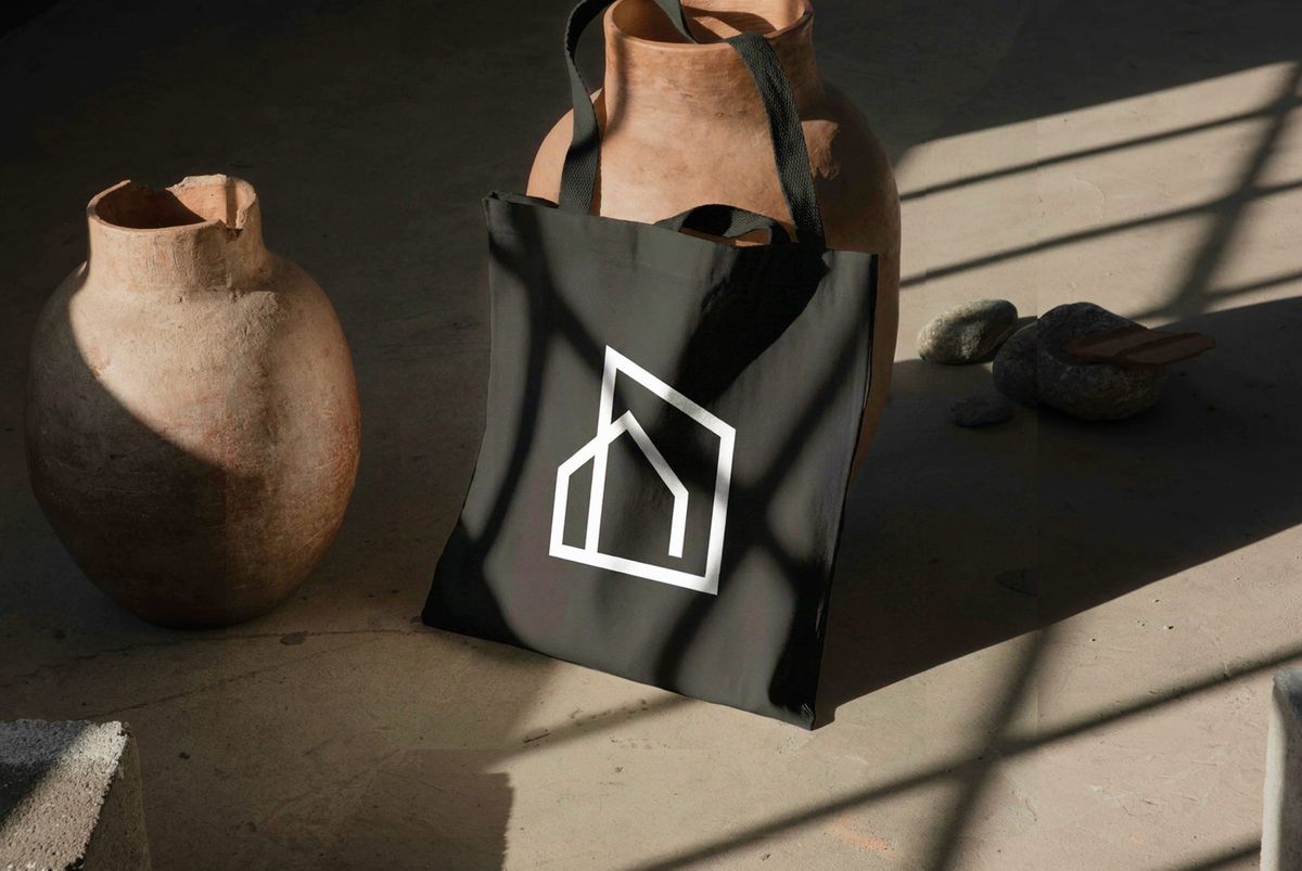 Black CITY HOME tote bag with the house symbol