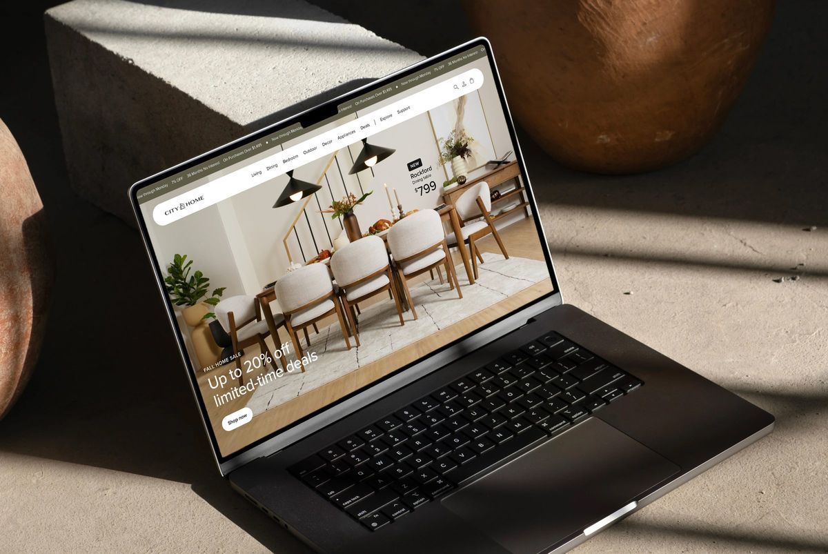 The CITY HOME website on a laptop