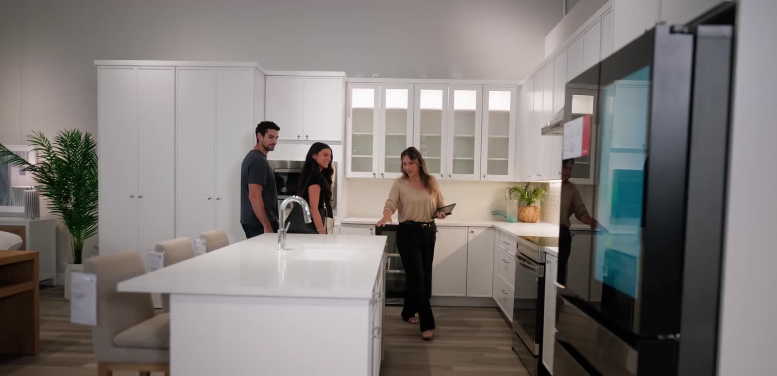 Shoppers exploring a kitchen display